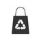 Black isolated icon of eco bag on white background. Silhouette of recycle shopping bag.