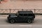 Black Jeep Wrangler SUV car on the city road. Fast moving vehicle on Moscow streets. Offroad 4x4 auto. Compliance with speed