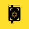 Black Jewish torah book icon isolated on yellow background. Book of the Pentateuch of Moses. On the cover of the Bible