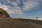 Black Karekare Beach with the Watchman Rock in distance.