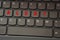On the black keyboard, the inscription is highlighted in red - Alert