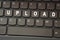 On the black keyboard, the inscription is highlighted in white - UPLOAD