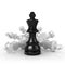 Black king standing over fallen white chess pieces