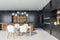 Black kitchen interior with bar and table