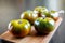 Black Krim organic tomatoes on a cutting board