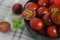 Black kumato tomatoes in the bowl on the table