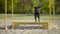 Black labrador retriever jumping at obstacle