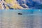 Black labrador retriever swimming in Oeschinen lake Oeschinensee near Kandersteg in Bernese Oberland, Switzerland