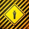 Black Larva insect icon isolated on yellow background. Warning sign. Vector