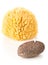 Black lava pumice stone and natural sponge spa or bath utensil used for peeling or callused skin removal over white