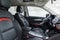 Black leather car interior. Modern car illuminated dashboard. Luxurious car instrument cluster.