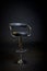 Black leather and chrome barbershop chair.