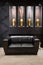 Black leather couch in anteroom