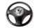 Black leather shiny steering wheel with a metal frame a separate part of the car on a white isolated background in the workshop