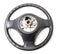 Black leather shiny steering wheel with a metal frame a separate part of the car on a white isolated background in the workshop