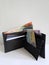 black leather wallet with australian banknotes and white background