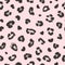 Black leopard or jaguar seamless pattern design on pink background. Trendy fashion fabric design. Vector illustration.