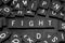 Black letter tiles spelling the word & x22;fight& x22;