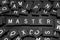 Black letter tiles spelling the word & x22;master& x22;