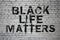 Black live matters Words on brick wall. Stop racism social blm concept