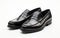 Black Loafers on a White Background GENERATIVE AI