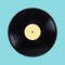 Black long-play vinyl record with yellow label isolated on cyan background front view close up