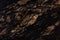 Black Magma granite texture in strict dark color, natural background.