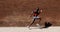 Black male Athlete Sprinting on Sidewalk