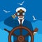 Black male captain looking through binoculars standing at helm of boat