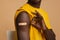 Black Male Demonstrating Adhesive Bandage On Shoulder And Showing Ok Gesture, Closeup