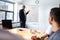 Black male executive standing in front a whiteboard