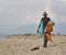 Black male handkerchiefs shopkeeper offers his goods on a sandy