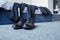 Black male leather shoes on floor in bedroom with business suit placed on bed