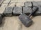 Black Mallet close-up on a background of square granite stones and sand