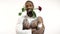 Black man in bodyart with a rose in his teeth because of him comes a white man with a gift in his hands, birthday