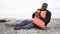 Black man crying hugging life jacket, survived plane crash on deserted island