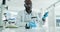 Black man, dropper or scientist in laboratory for liquid particles, medical study or test experiment. Glass, pipette or