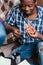 Black man eat pizza with soda at home, closeup