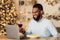 Black man having dinner drinking wine making videocall