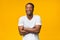 Black Man Laughing Crossing Hands Looking At Camera, Studio Shot