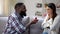 Black man making proposal to happy emotional girlfriend, engagement ring, love