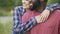 Black man and mixed race woman tenderly hugging, happy people smiling together