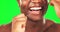 Black man, mouth and flossing, teeth whitening on green screen with hygiene and oral health for dental care. Happy male