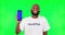 Black man, point at phone and mockup, green screen and volunteer, community service with app on studio background