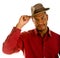 Black Man in Red Shirt Tipping Brown Hat