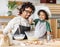 Black man and son cooking together in kitchen