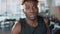 black man is training in fitness center, run on treadmill, closeup portrait of face, exhausted man