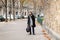 Black man walking with bag in paris france street fall