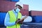 Black man working in covid with face mask, shipping container in supply chain industry and logistics stock inventory