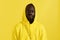 Black man in yellow hoodie with shocked face, colorful portrait